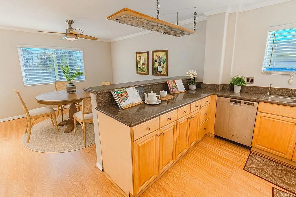 Open-concept living room with vaulted ceilings and natural light