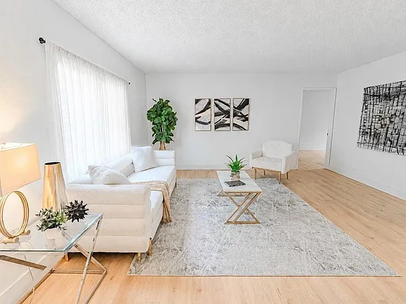 Remodeled kitchen with quartz countertops and new cabinetry at 634 8th St Apt 8