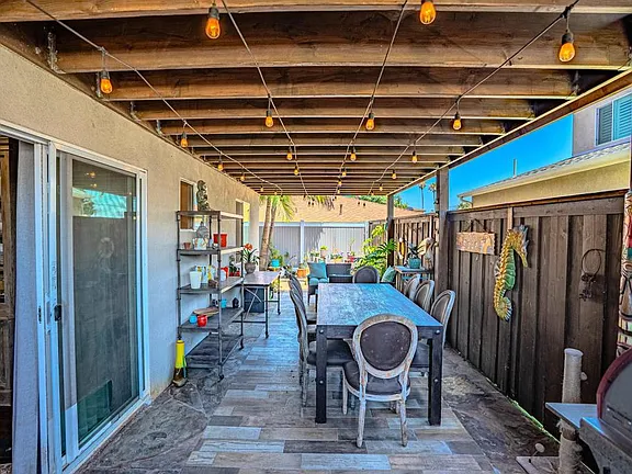 Outdoor entertainment space at 569 Delaware St featuring built-in BBQ and firepit