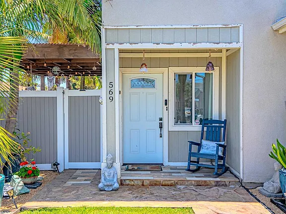 Backyard entertainment area at 569 Delaware St with pergolas and outdoor living space