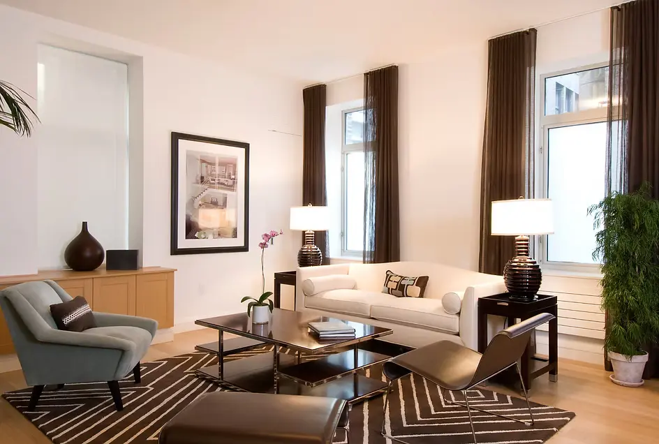 Light, updated window treatments brightening a room