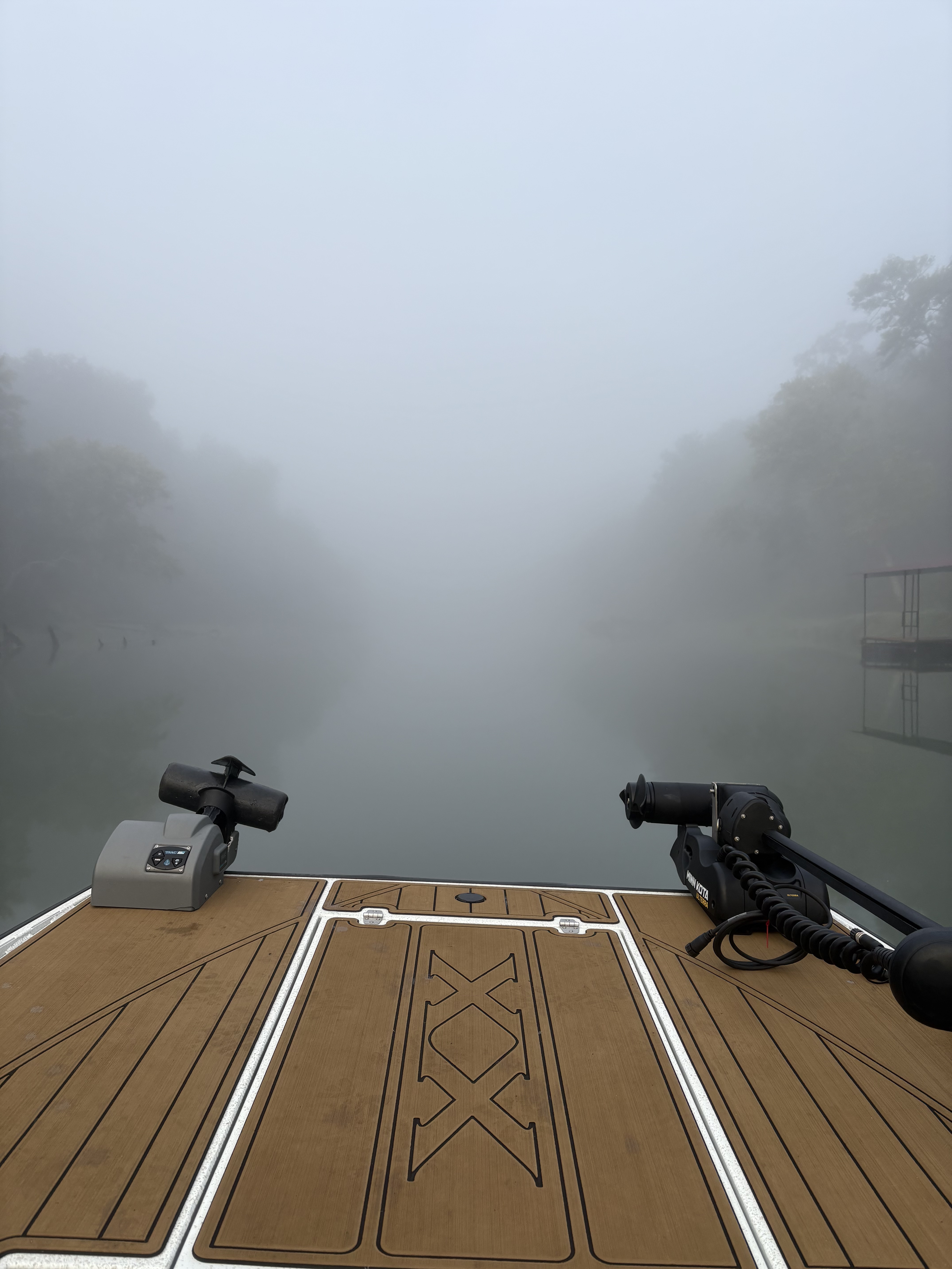 Fall colors on the Little Red River banks with orange and red foliage reflected in clear water