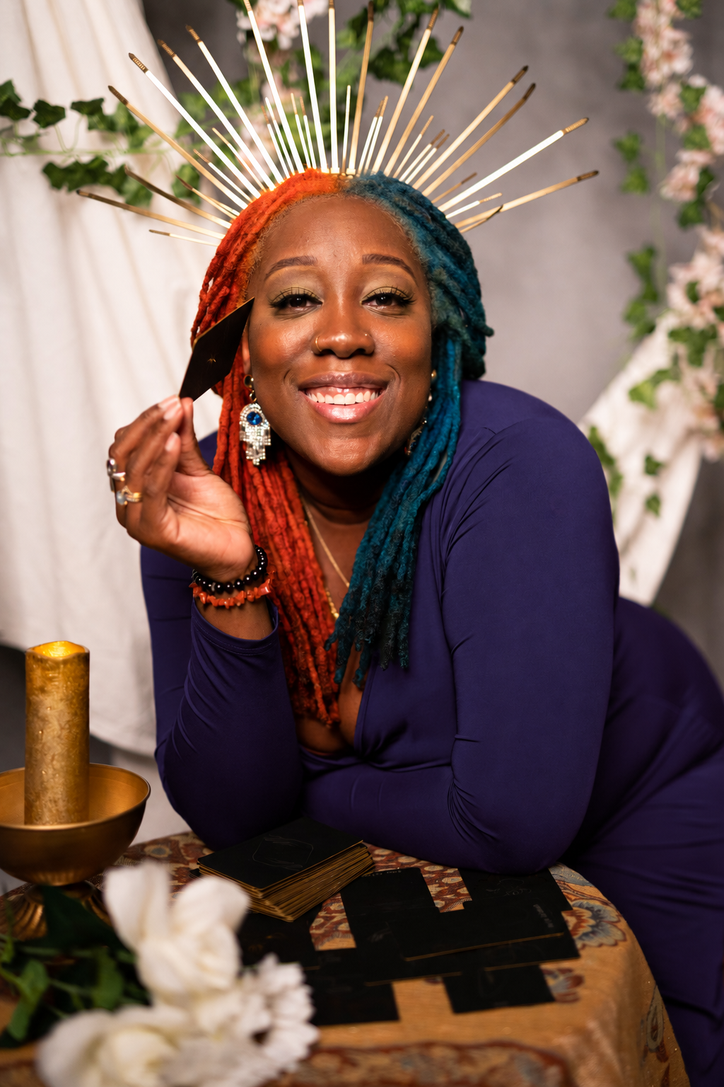 Tanisha Yorrick wearing a deep purple dress and gold crown