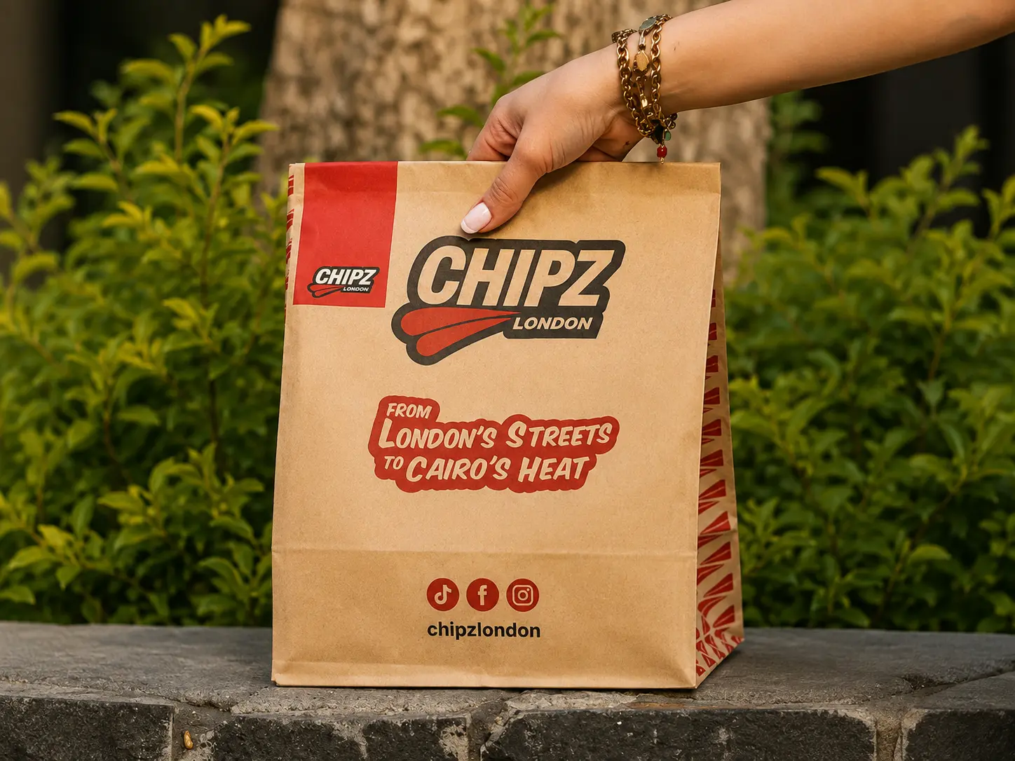 CHIPZ London branded takeaway bag with the From London's Streets to Cairo's Heat slogan