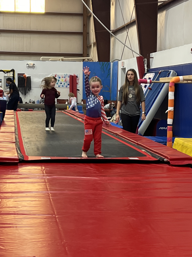 Young child doing a forward roll