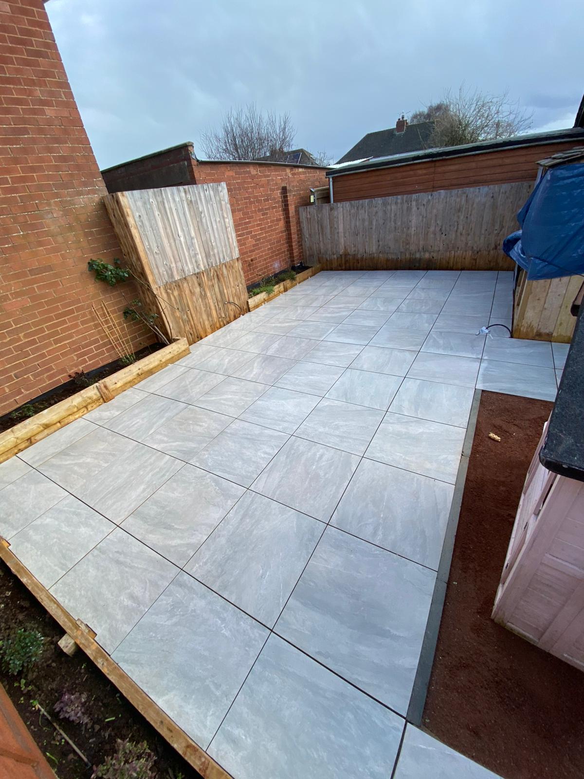 Natural Stone & Porcelain Patios — Beautiful, durable patios across Exeter and South Devon in porcelain and natural stone, laid on a proper sub-base and backed by our 10-year guarantee