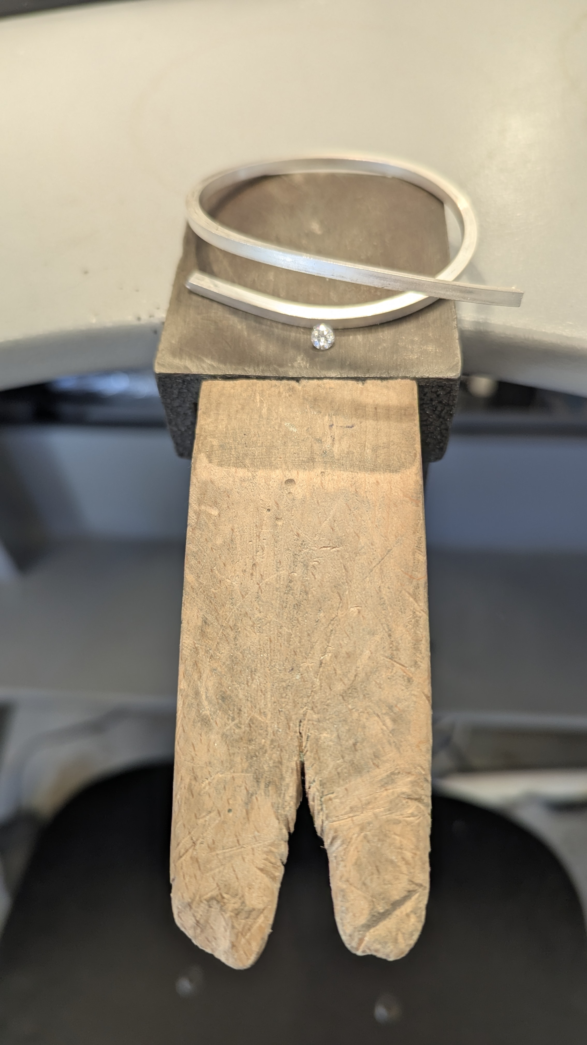 Image of the metal and diamond before the engagement ring was made Image of the metal and diamond before the engagement ring was made