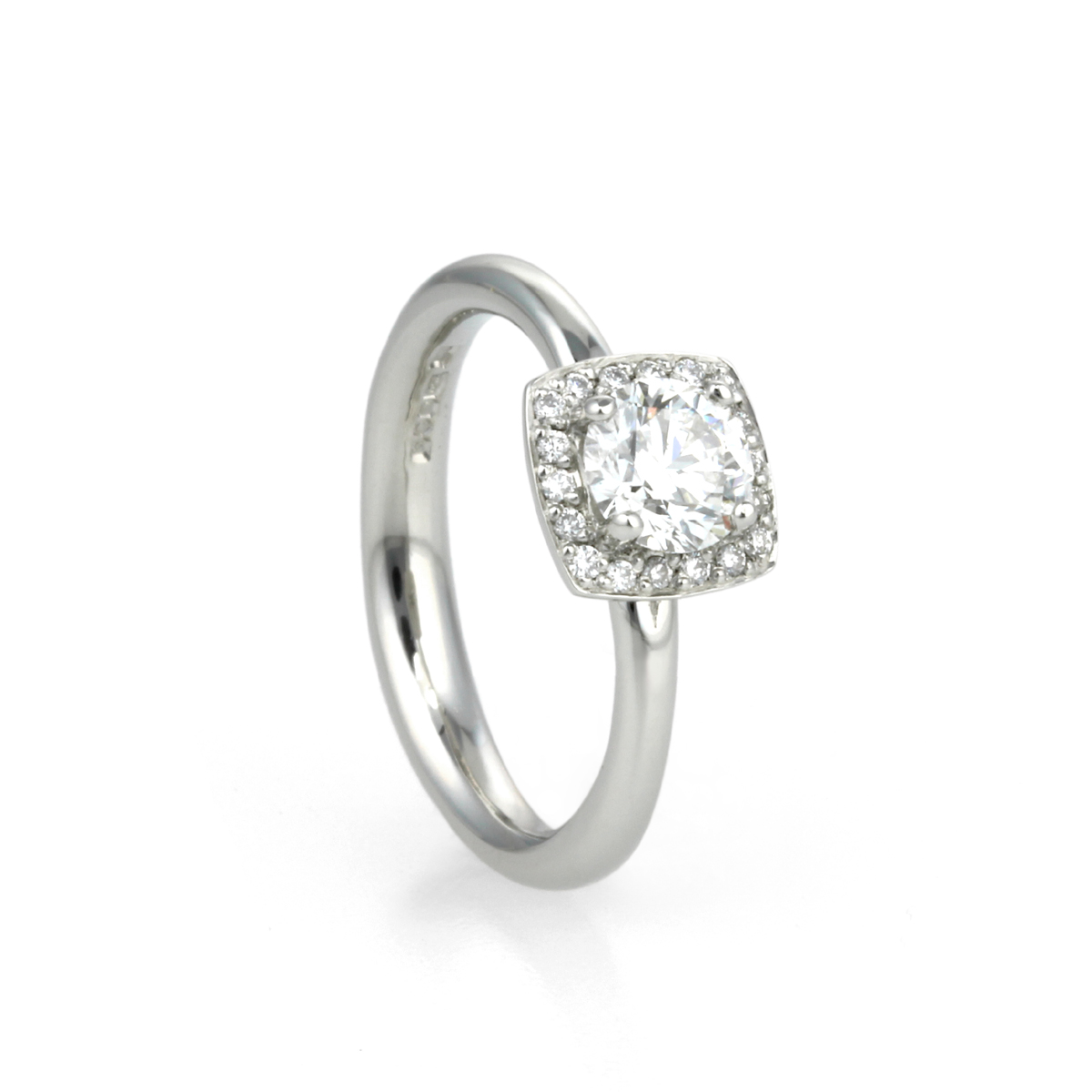 Image of a platinum and diamond halo engagement ring designed by Aimee Winstone in Bristol