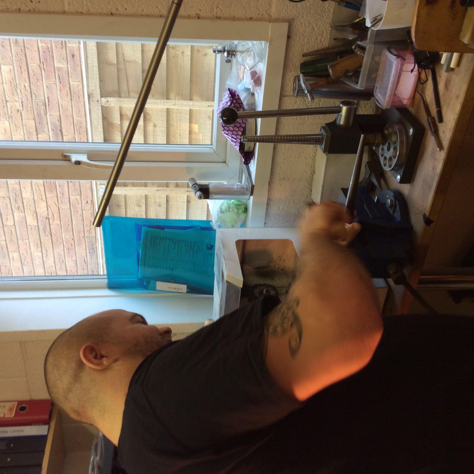 Hammering the metal around the ring triblet with a mallet