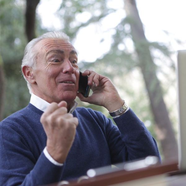 Business owner celebrating on a phone call