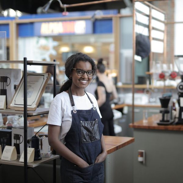 Cafe owner smiling in her shop