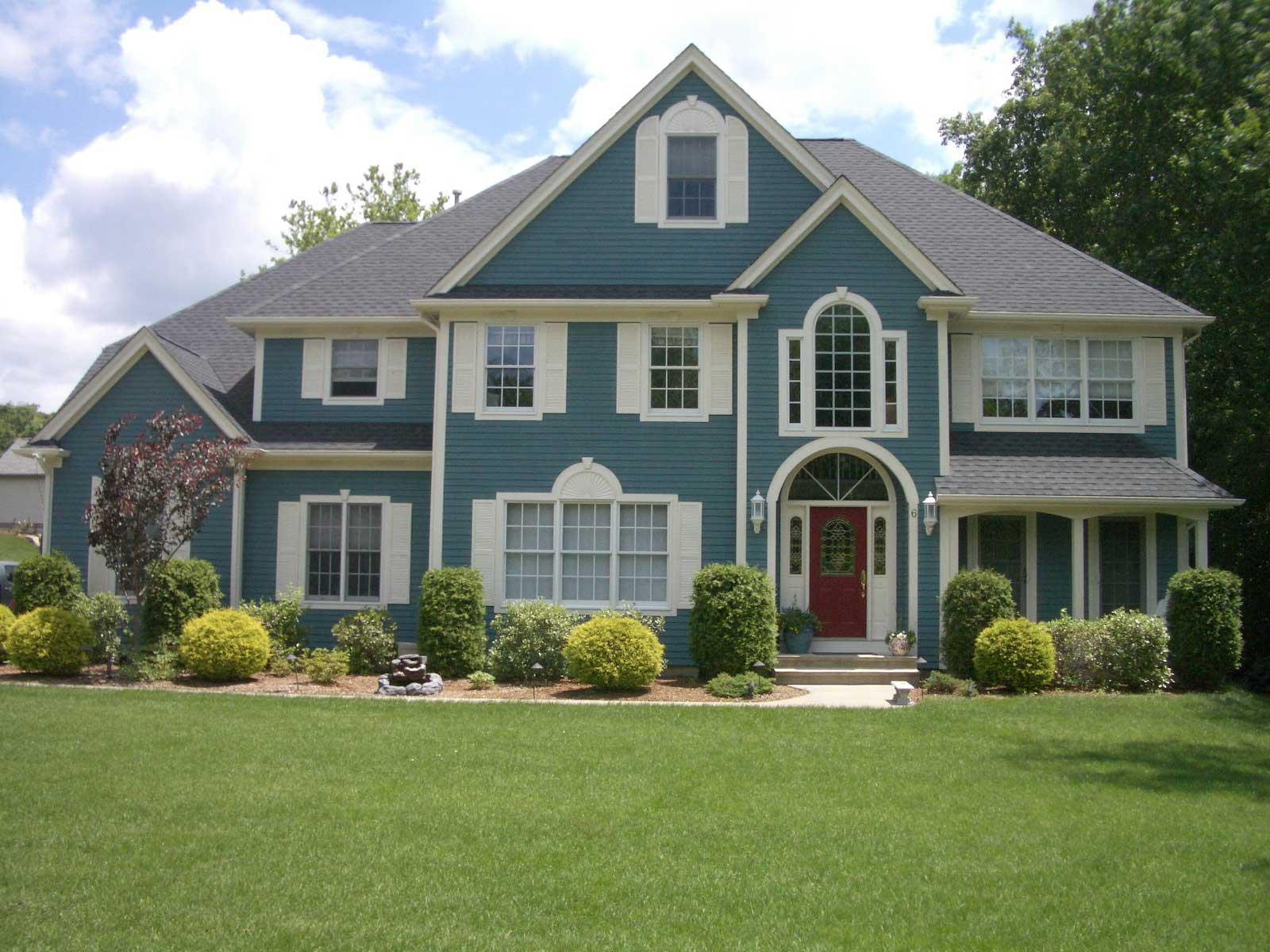 Exterior painting project photo (blue house)