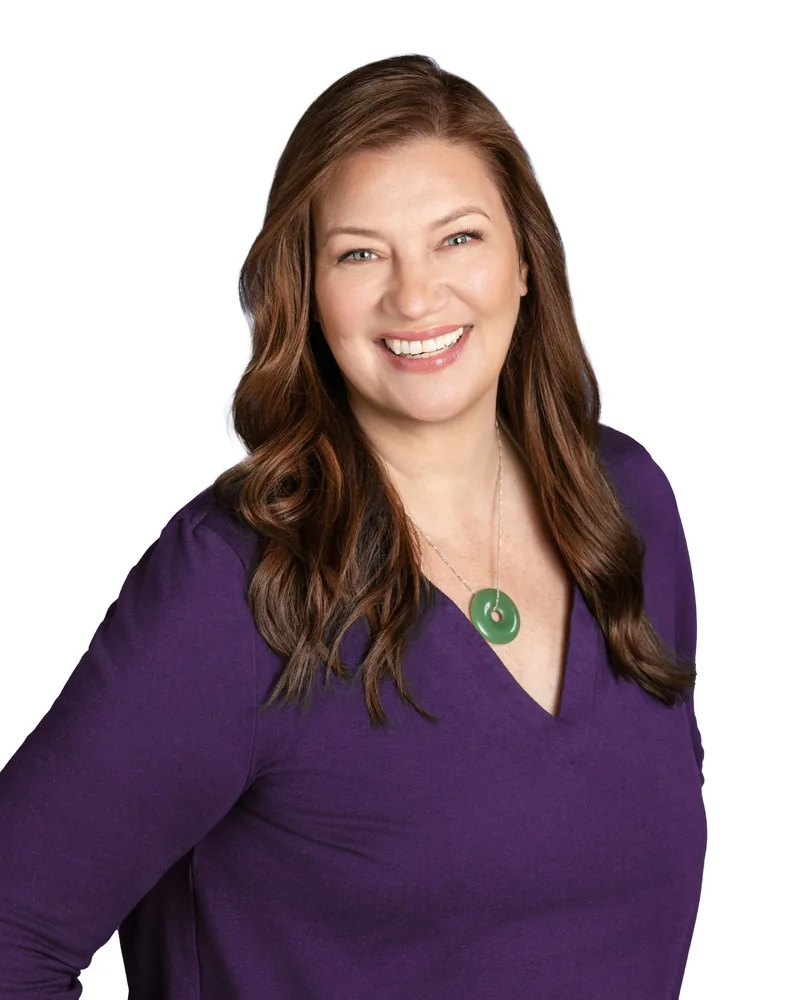 Rachel Chamness smiling in a purple blouse
