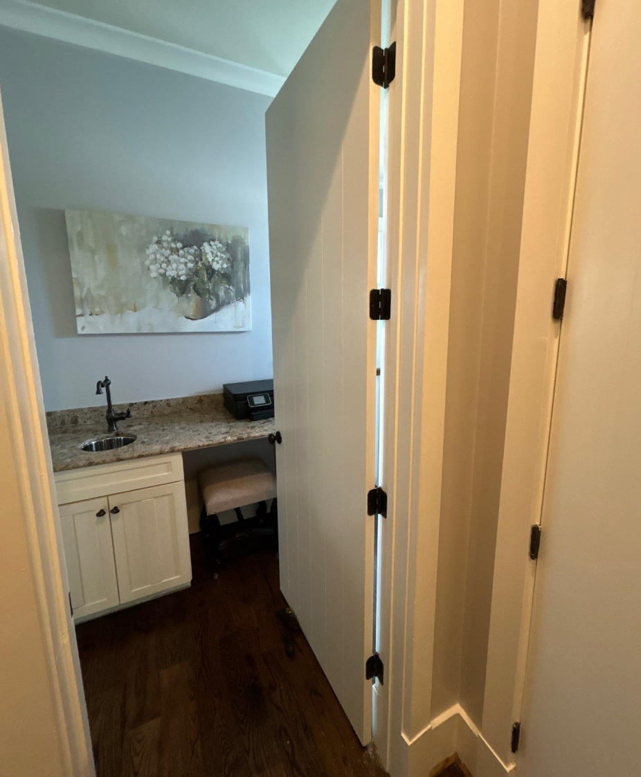 Interior door fully closed and hanging square after hinges were repaired and doors restored to normal operation