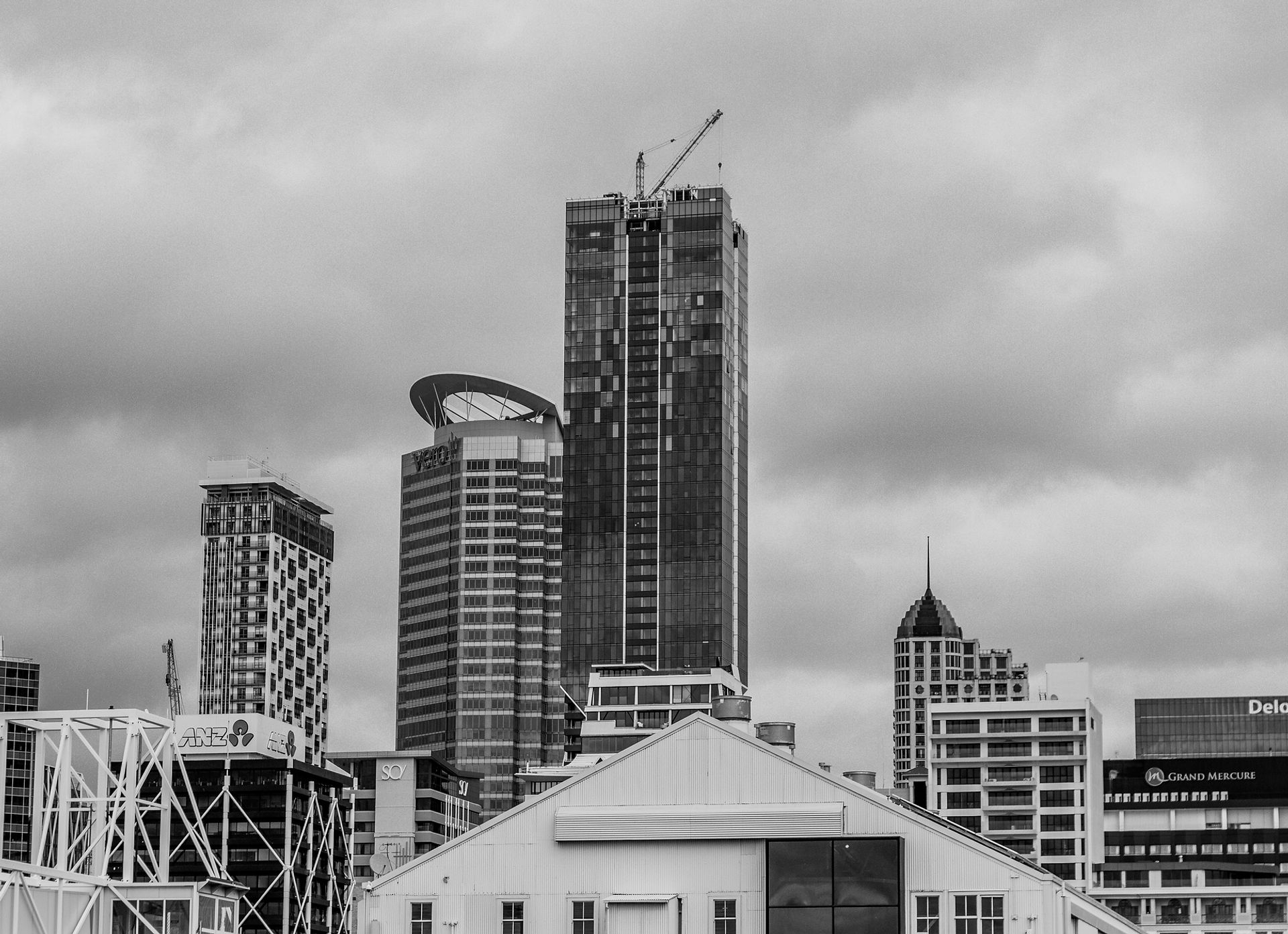 Auckland skyline at dusk behind client testimonials section