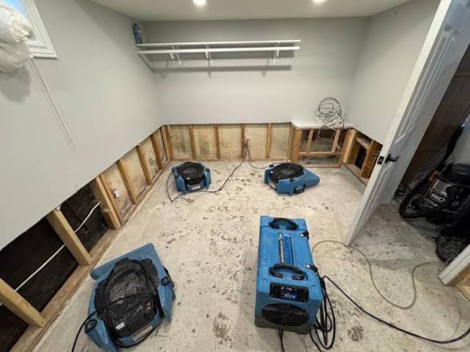Water damage drying job with air movers and dehumidifiers