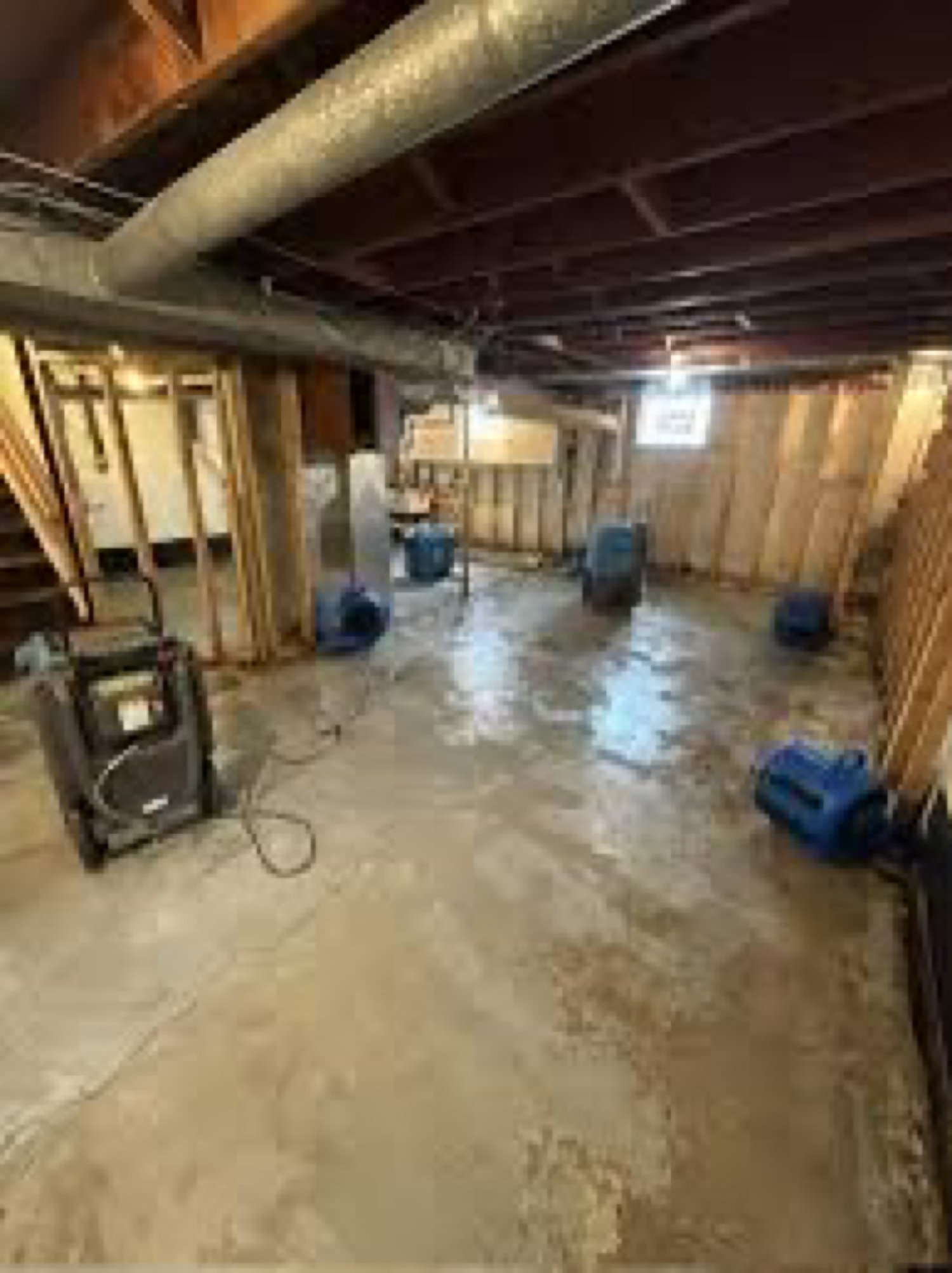Water damage drying job in a lower-level room