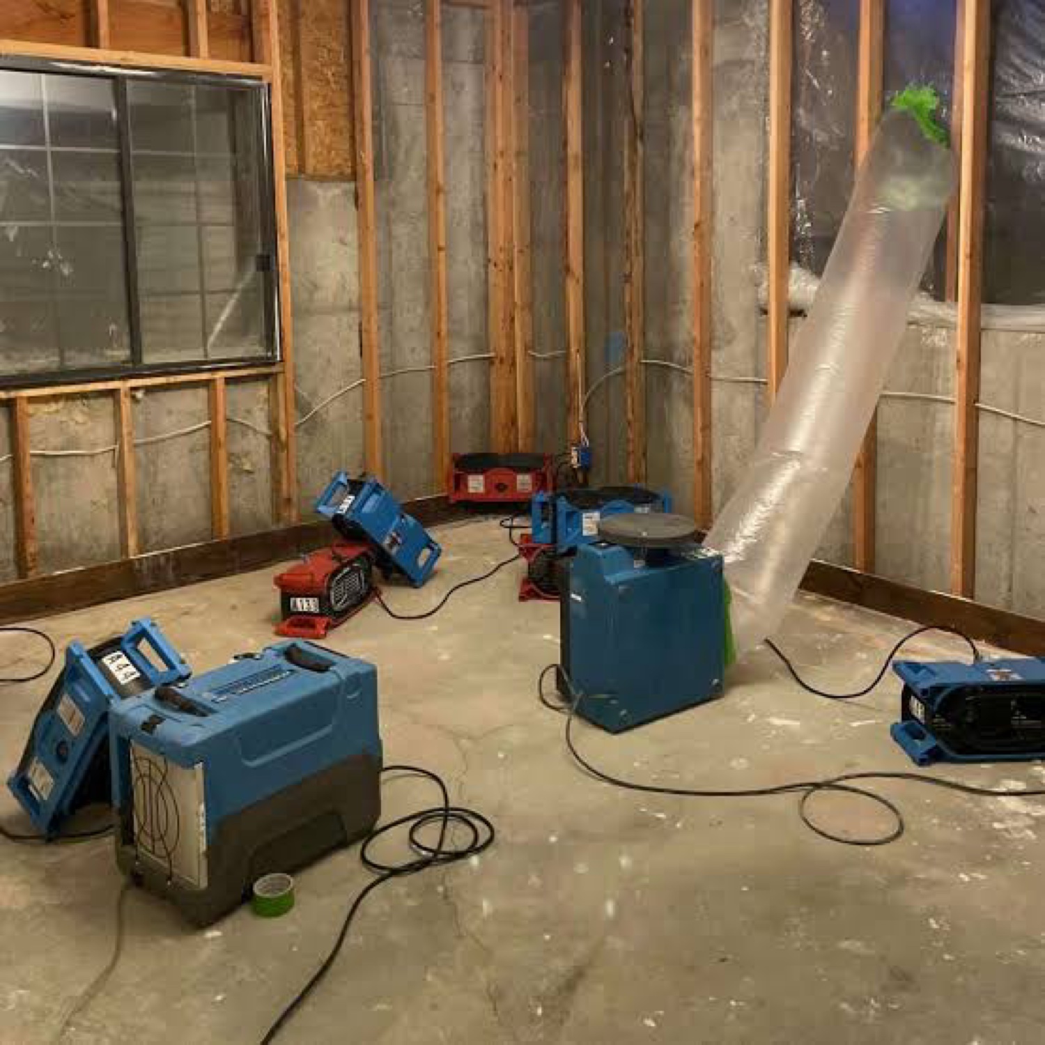 Water damage drying job with air movers and dehumidifiers