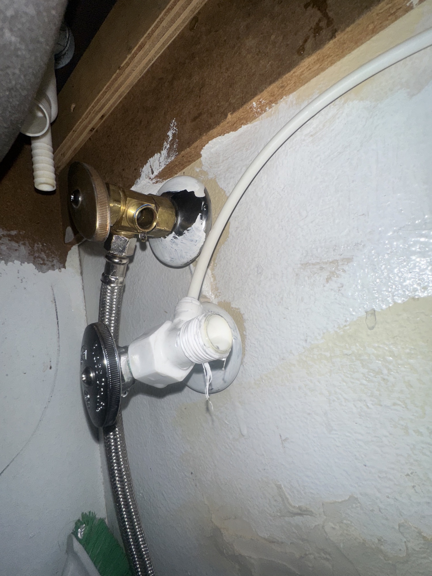 Opened wall showing the pipe behind a water leak