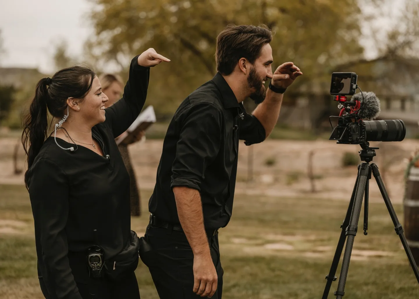 Aaron and Allyson filming a wedding together