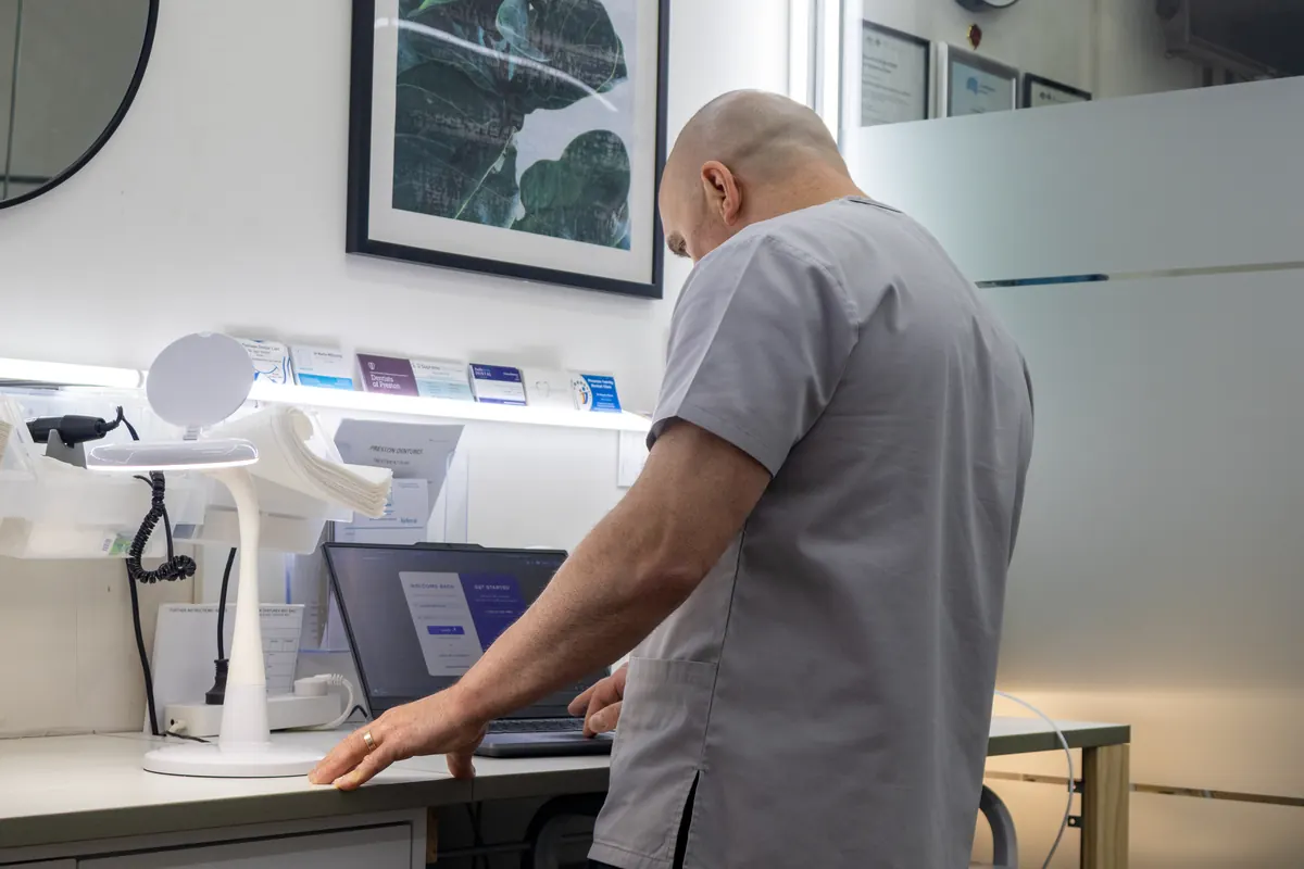 Digital denture design reviewed on a laptop at Preston Dentures