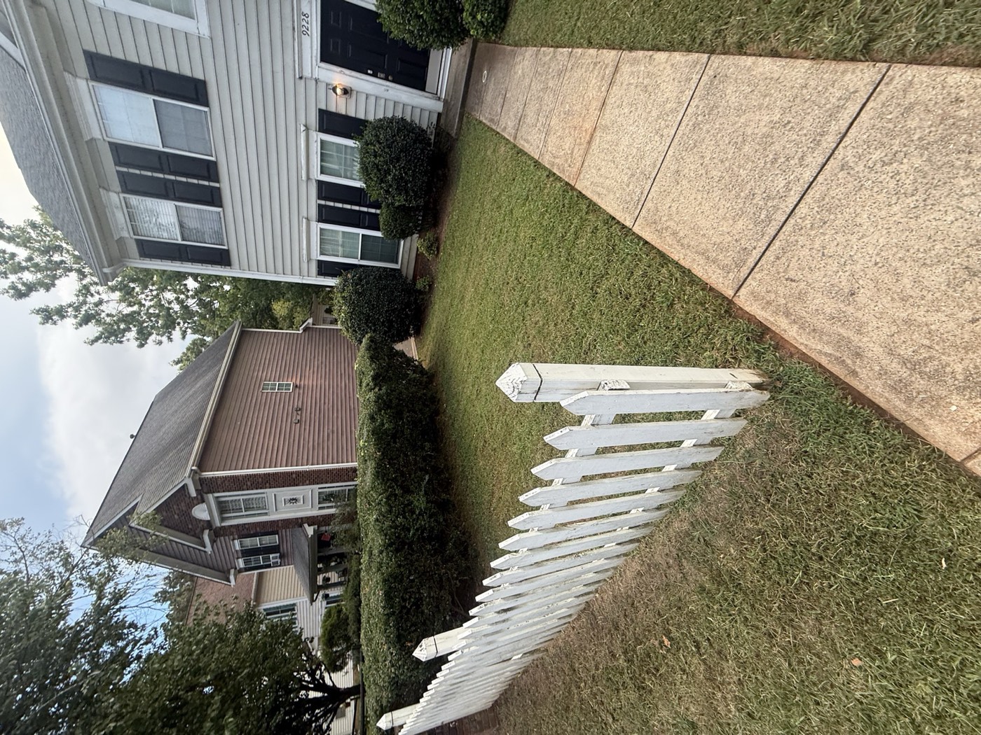 Trimmed hedges along front walkway