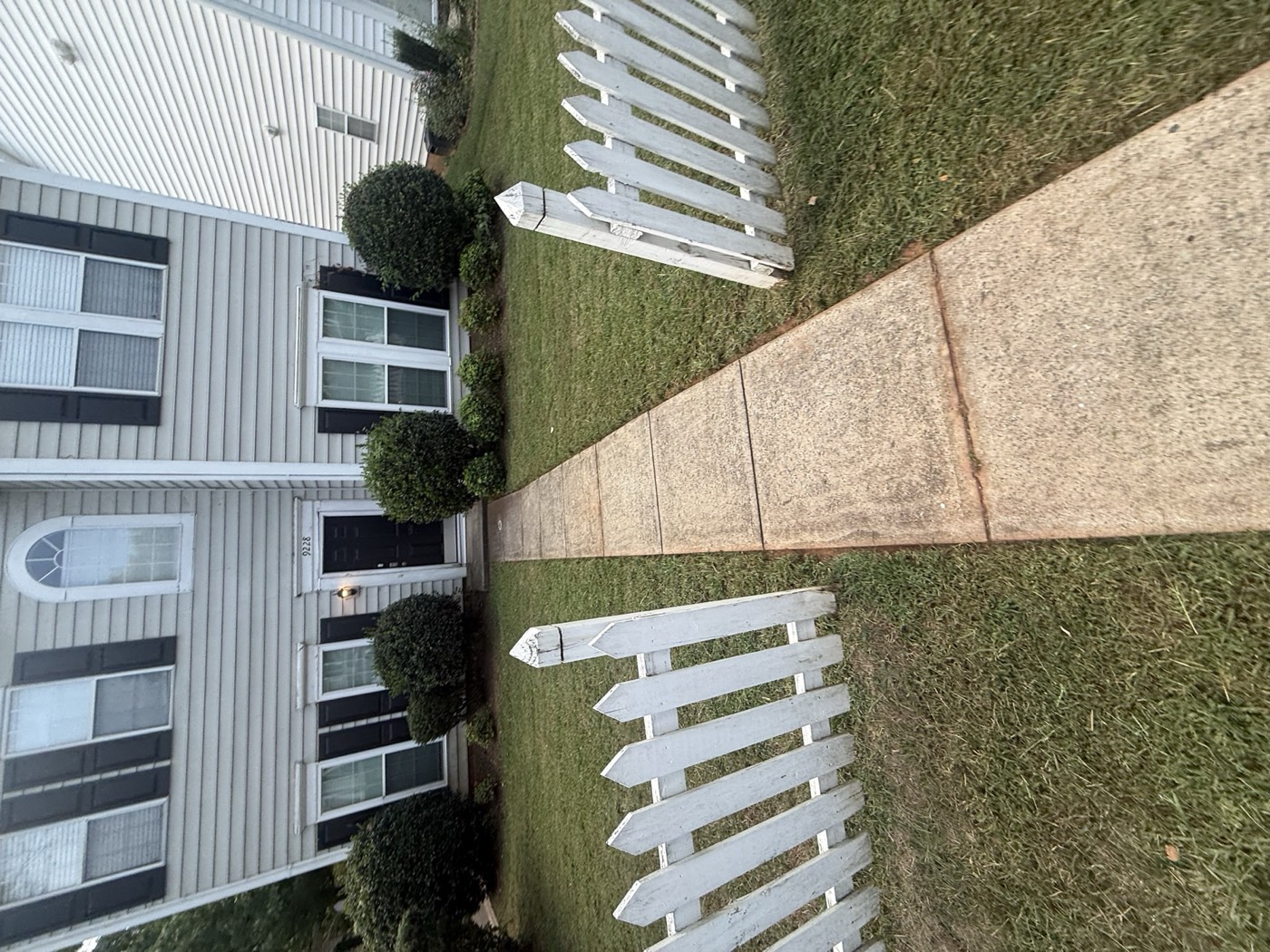 Front walkway and trimmed shrubs