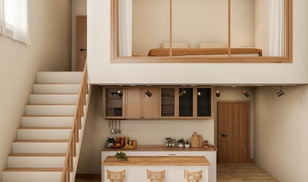 Tiny home interior with loft bedroom, staircase, and compact kitchen designed for small space living
