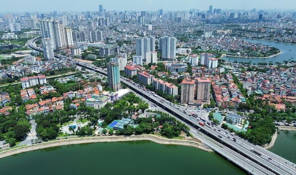 Dense urban neighborhood with high-rise buildings and roadway illustrating city living considerations for ADU homeowners