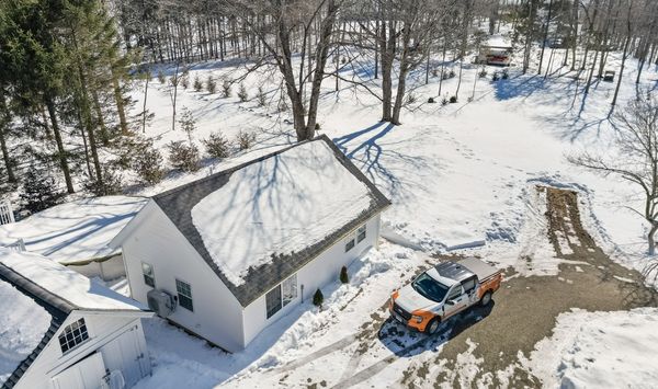 Aerial view of a detached ADU on a residential property, illustrating backyard placement and site layout