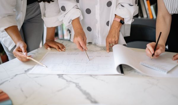 Team reviewing ADU floor plans during a Fairfield County Connecticut project planning meeting