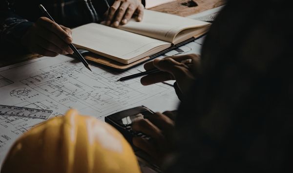 ADU feasibility planning meeting with building plans and site review for Connecticut property development