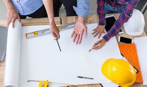 Connecticut ADU design team reviewing site plans and construction layout for accessory dwelling unit project