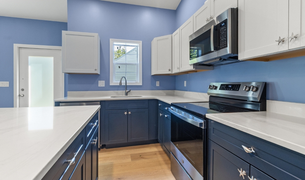 Blue and white kitchen interior inside a custom accessory dwelling unit