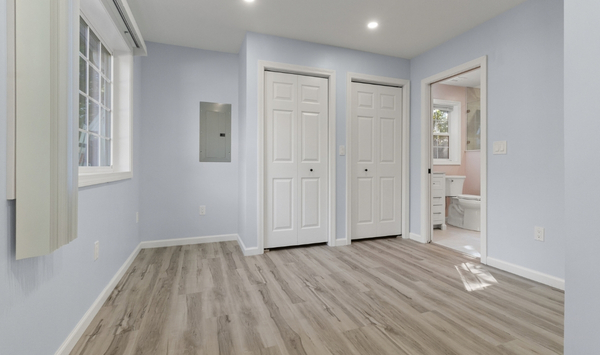 Finished custom ADU interior with bedroom storage and bathroom access in Connecticut Finished custom ADU interior with bedroom storage and bathroom access in Connecticut