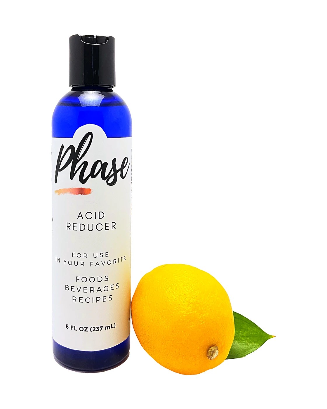 An 8 ounce Phase bottle beside a lemon