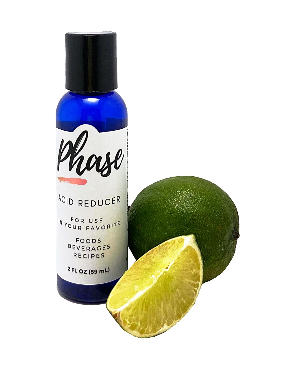A 2 ounce Phase bottle beside a cut lime