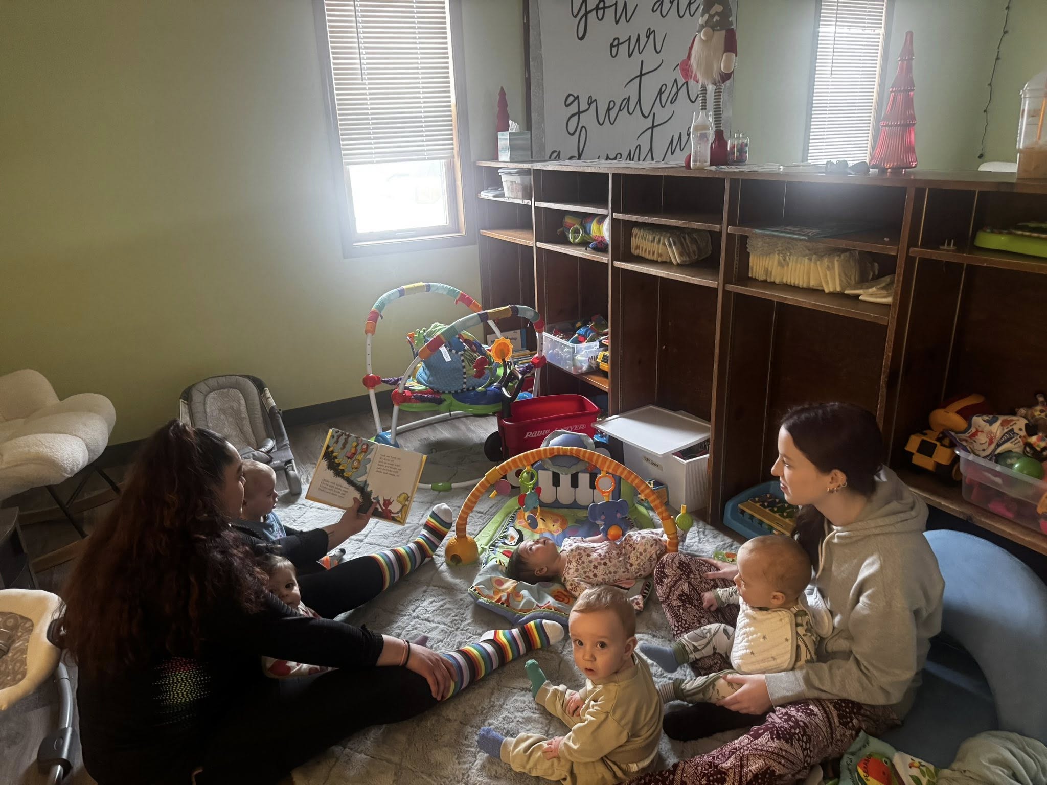 Caregiver reading to children