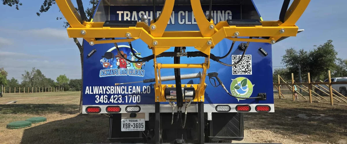 back view trash can cleaning truck