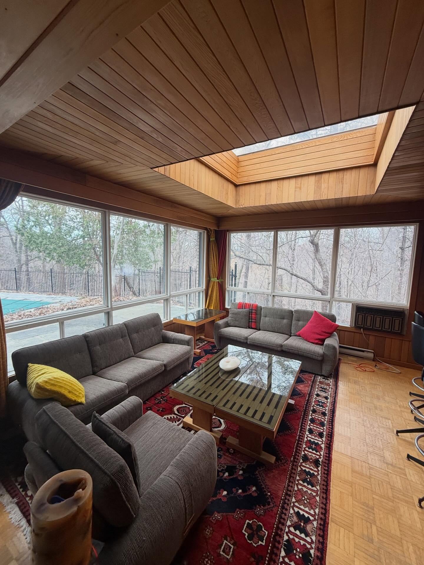 Bright residential living area with clear protected windows