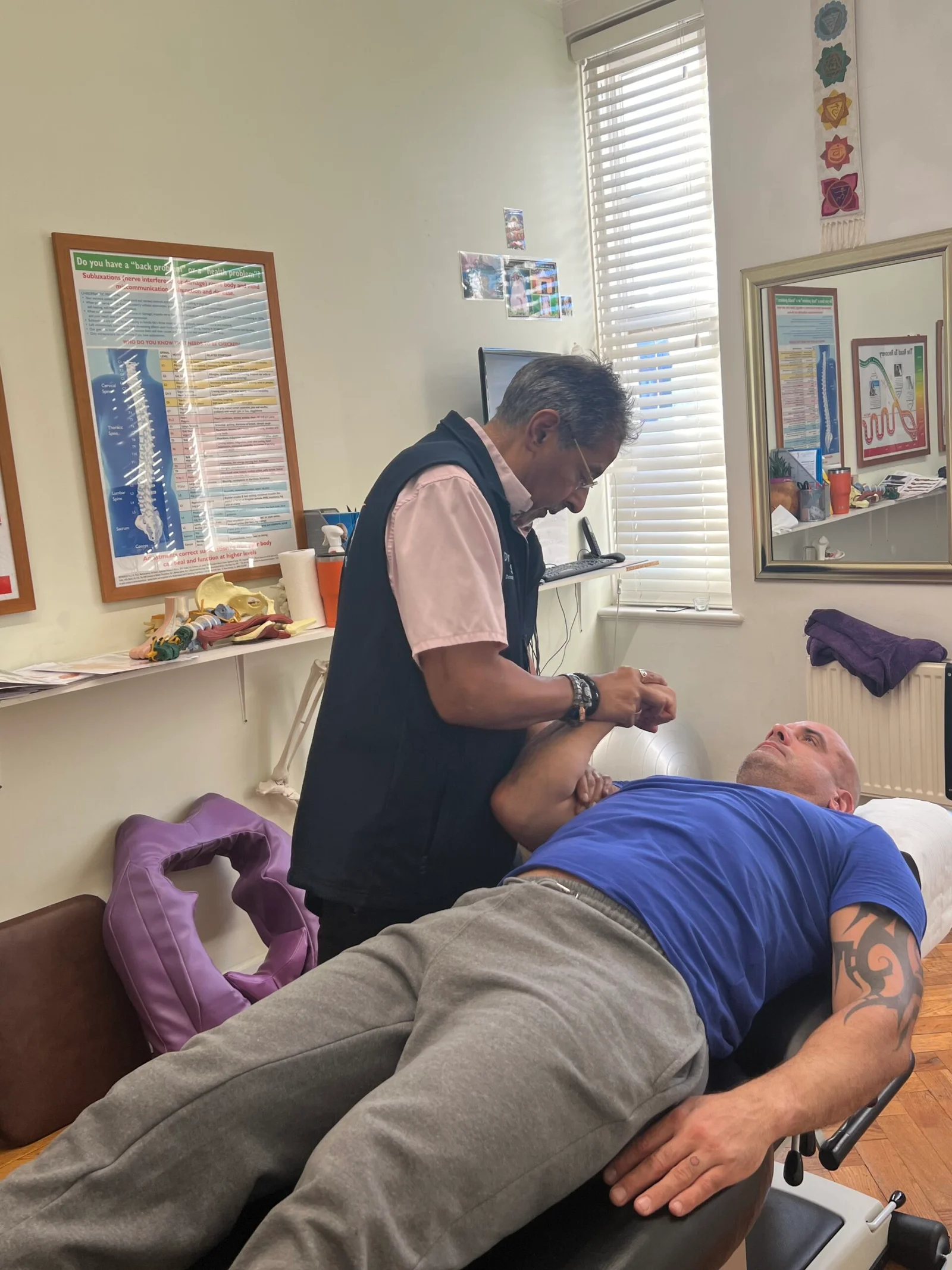 Dr Sandhu inside Bedford Chiropractic Clinic