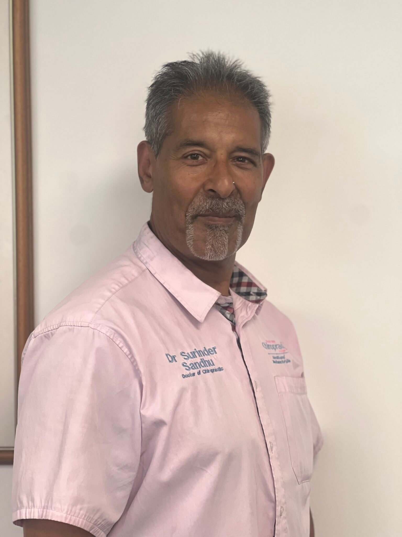 Dr Surinder Sandhu inside Bedford Chiropractic Clinic