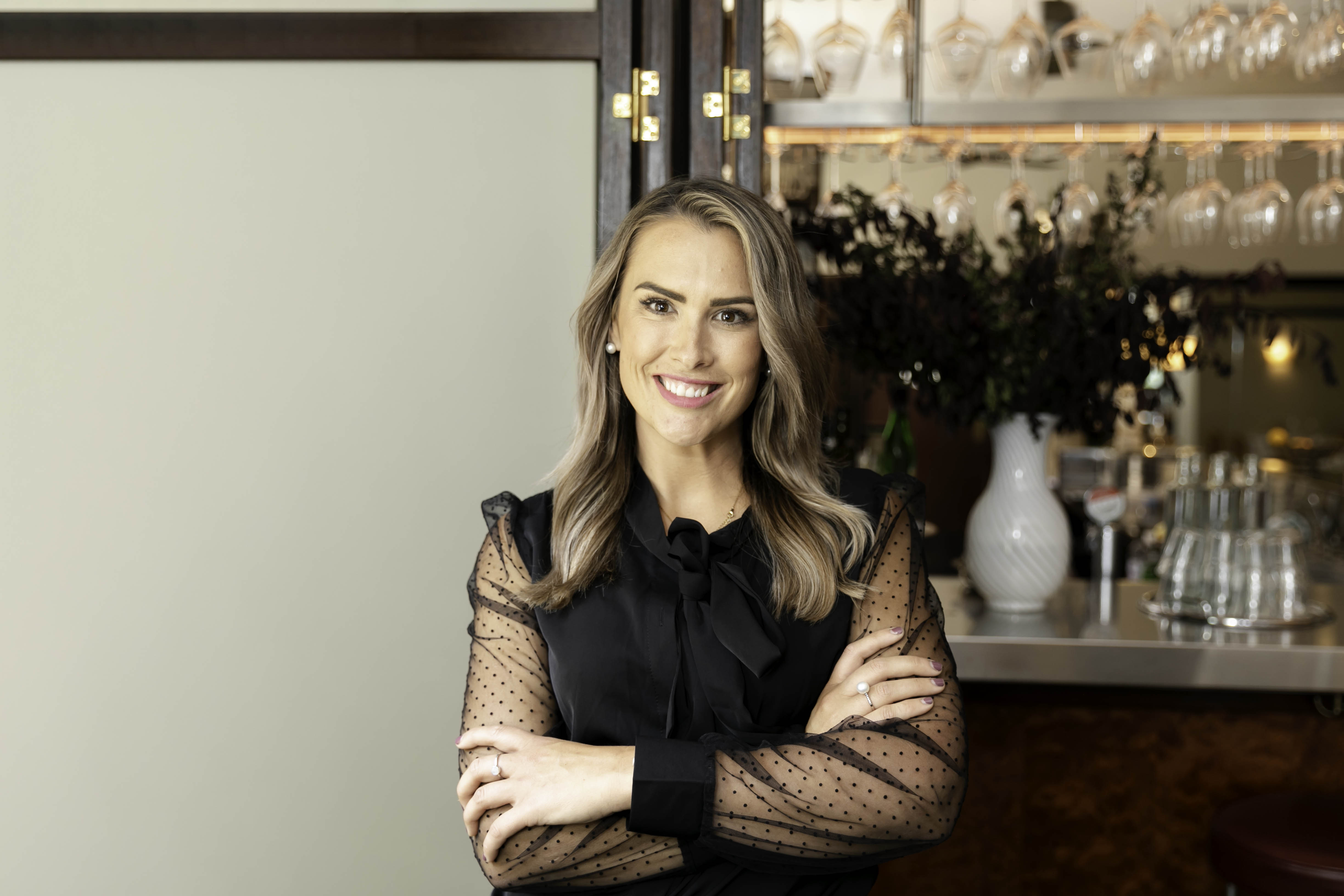Sarah, founder of Volumise Consultancy, in a bright salon