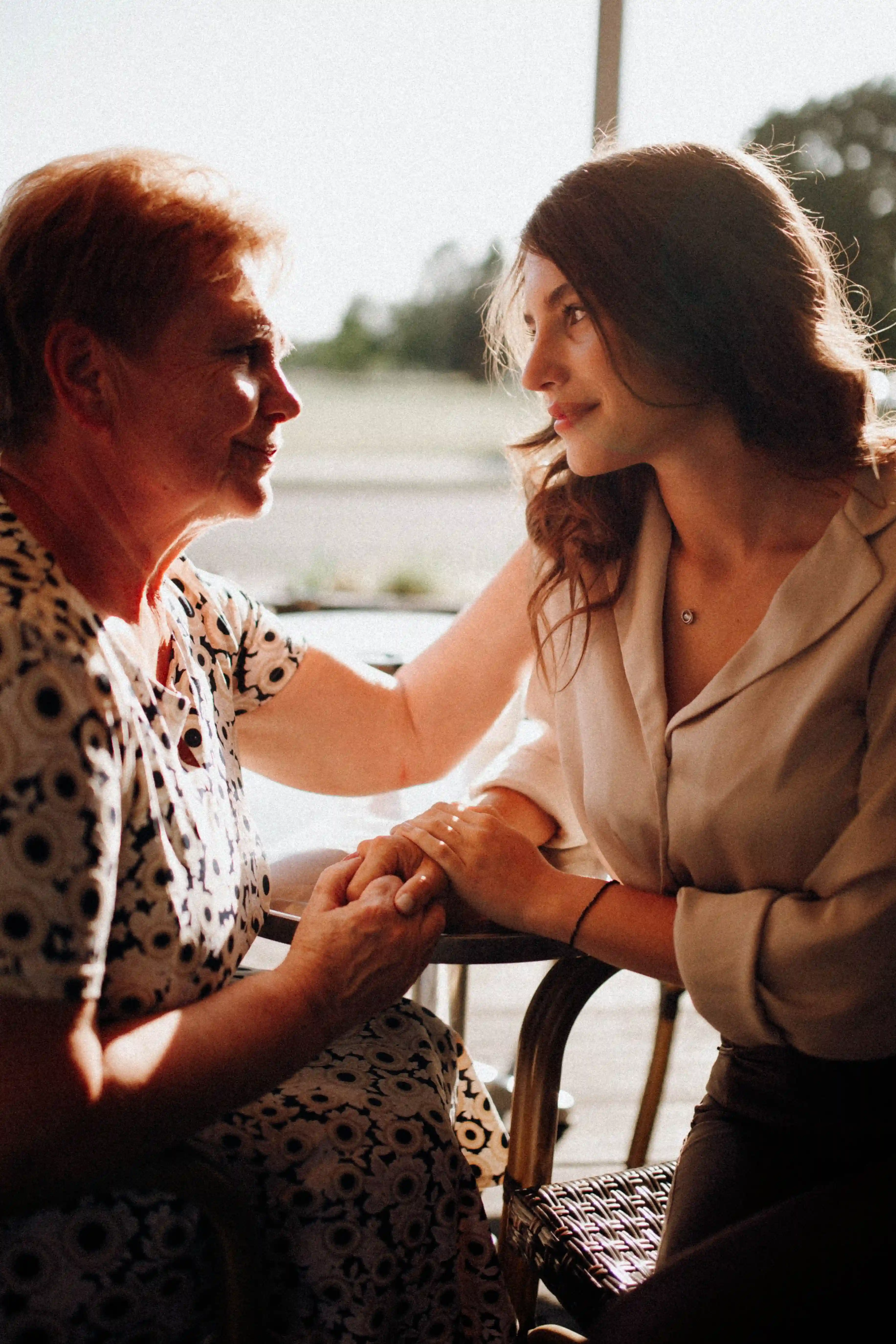 Carer supporting an elderly resident, illustrating long-term demand in the UK care sector