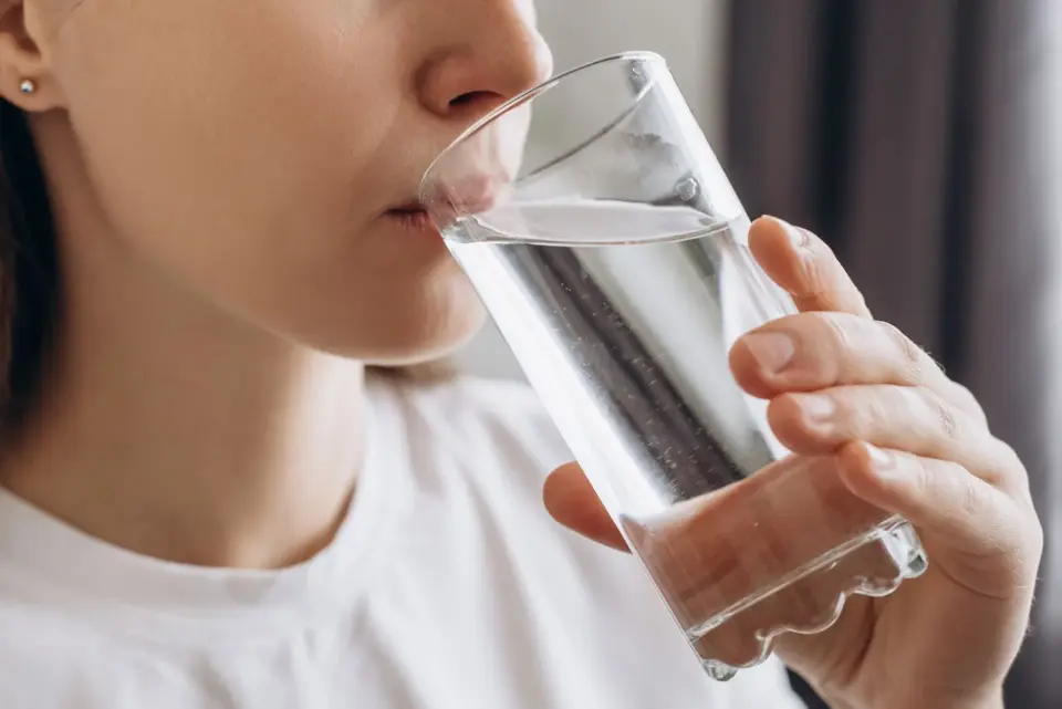 Woman drinking a glass of clean water