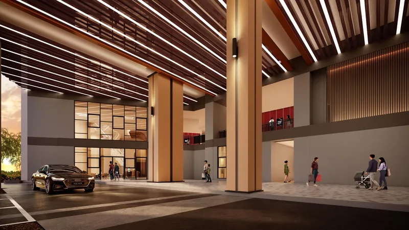 Covered drop-off and ground-floor shop arcade at Causewayz Square