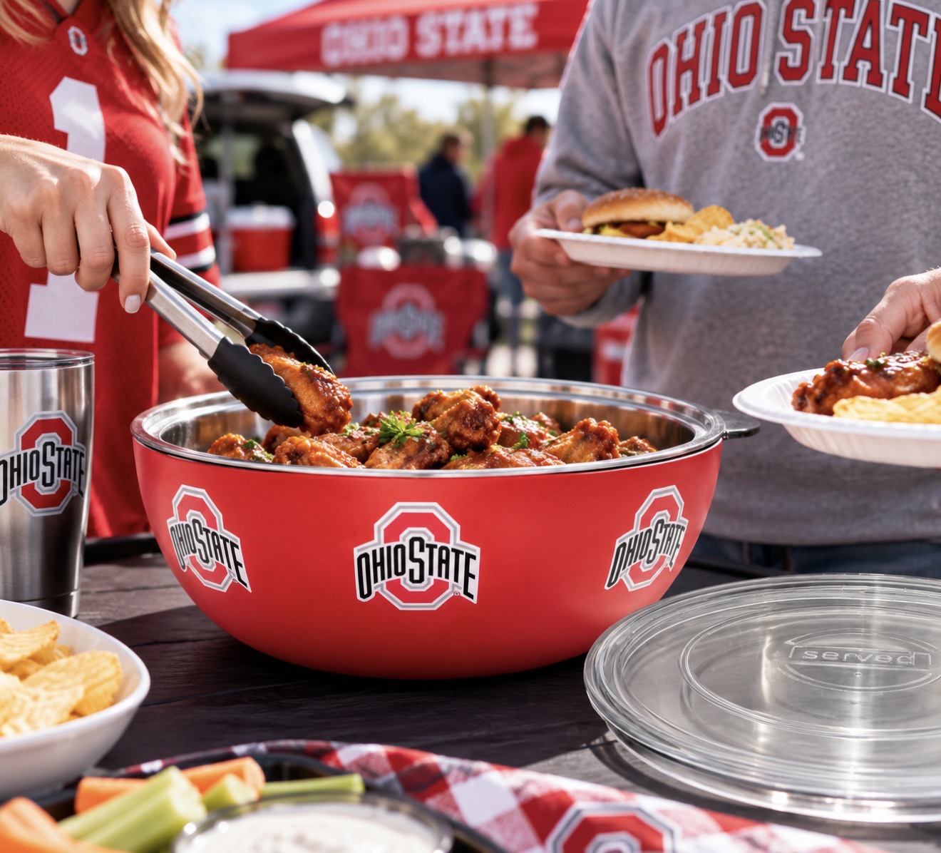 Ohio State fans serving food from the served vacuum insulated bowl at a tailgate