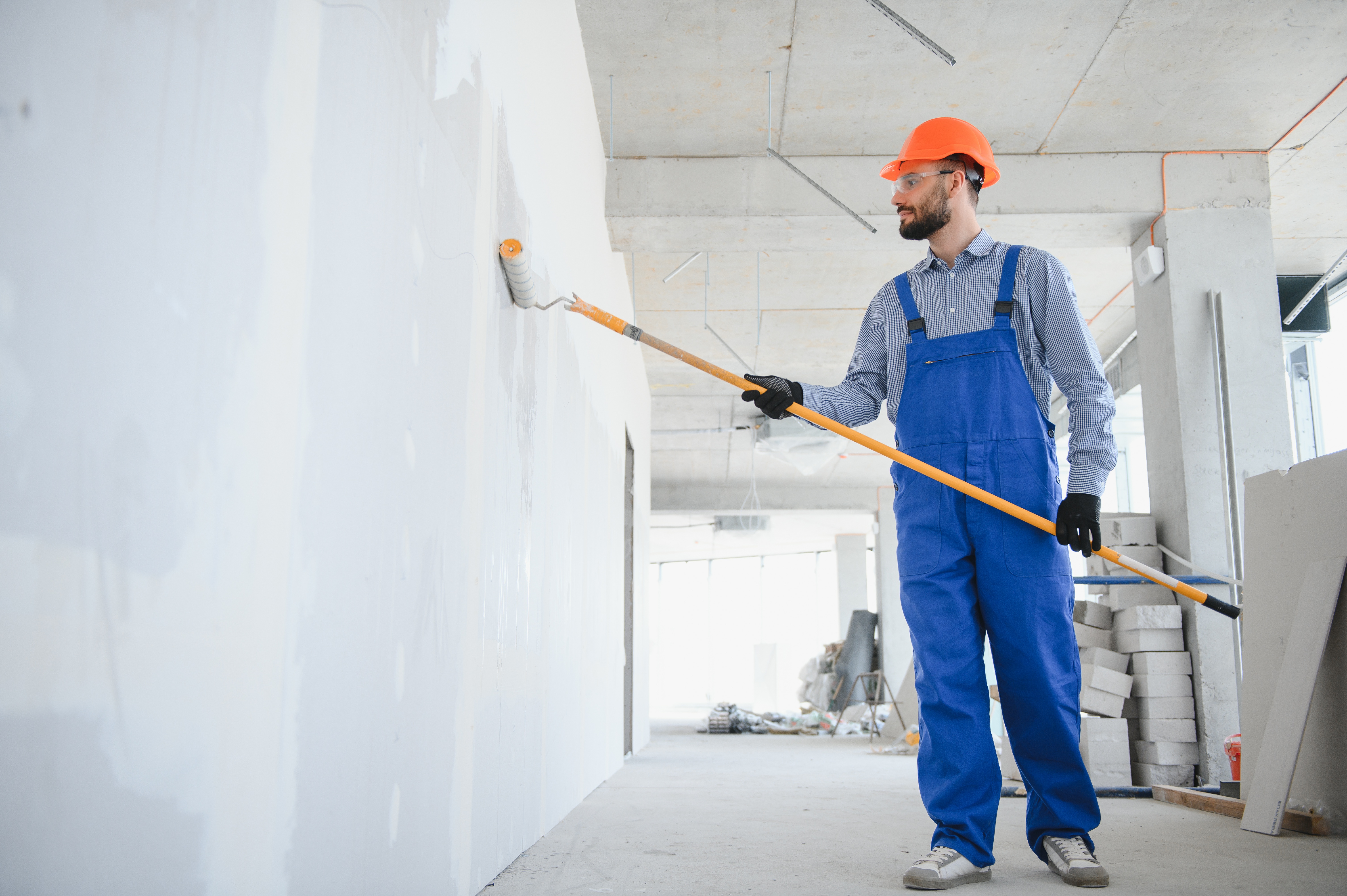 Commercial painting and construction professionals at work
