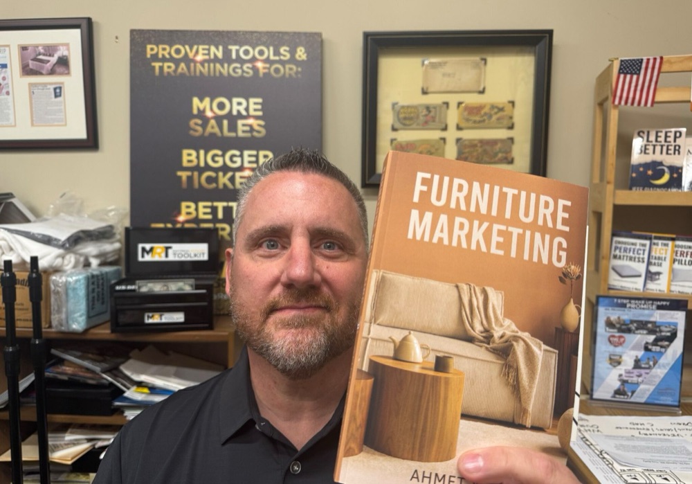 Jeff Giagnocavo holding the Furniture Marketing book
