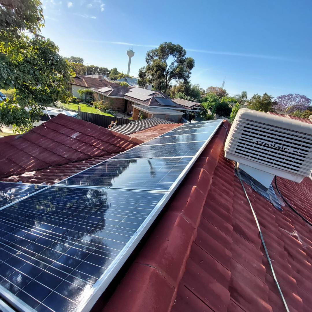 Clean solar panels on red tile roof in Mildura residential area